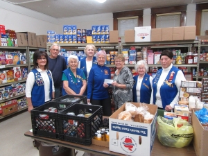 On Nov. 18, members of the VFW Post 1916 Auxiliary presented a check for $1,000 to the Reedsburg Food Pantry. Present for the donation were Jolee Mockler, Mike Ray of the Food Pantry, Karen Boehlke, Barb Unrath, Jan Wirth, Shirley Henry of the Food Pantry, Joanne Biesek, and Janet Montgomery. (Submitted photo)
