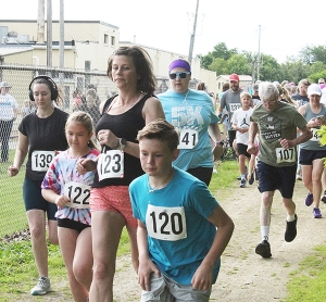 There was a wide range in the age of the runners and walkers that participated in the 2k event as part of the Run for the Butter. Eagle Street along the 400 Trail was the starting point for this year’s festivities. (Photo by Troy Matz)
