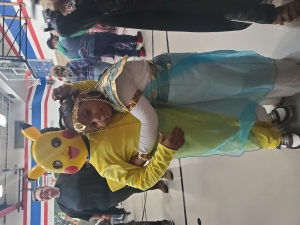 Liam Lindo (as Pikachu) receives a hug from Princess Larissa Lindo.