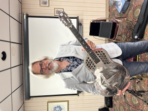 The Sauk County Retired Educators group met at Marty’s Steak House in Reedsburg on May 14. Christo Ruppenthal explained the history of the Hawaiian music craze in the United States during the early part of the 1900’s. He played several numbers on both the Resonator guitar and an antique electric guitar.  The next meeting will be at the Kraemer Public Library in Plain on June 11. (Photo by MJ Miller).