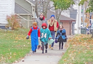 Last Tuesday night was cold, damp and chilly last week, but kids still took to the streets in search of sweets. Plenty of adults also dressed up for the occasion. Reedsburg’s trick-or-treat hours always take place the evening of Oct. 31. (Photos by Heather Stanek)