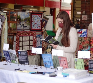 Shoppers browse the wares at last Saturday’s vendor fair during the Reedsburg Fire Department Fall Festival. It was held in the station to help raise money for the department.