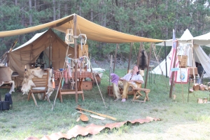 A re-enactor catches a nap last Friday afternoon during the Rendezvous at the Pioneer Log Village.