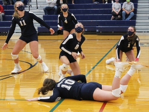 Three Beaver volleyball players, Mahra Wieman (No. 10), McKenna Oetzman (No. 8) and Delaney Horkan (No. 1) all get to the floor to keep the ball alive during this volley vs. Edgewood last week in action at RAHS. Edgewood won the match 3-1 as Reedsburg suffered its first dual match loss of the season. (Photo by Troy Matz)