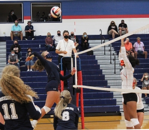 McKenzie Bestor is airborne and ready to slam the ball hard across the net for the Beaver volleyball team in the season-opening match last week vs. Portage. Bestor and the Beavers won the match in straight sets. (Photo by Troy Matz)
