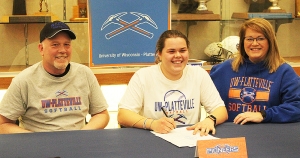 RAHS senior Melissa Dietz, middle, signed a National Letter of Intent last week to play softball at UW-Platteville, starting in the fall of 2022. Dietz is pictured with her parents during a ceremony last week at RAHS. In a brief statement, Dietz thanked all her coaches for their help and cooperation in helping to make her the softball player she has become along with friends and family for their support and indicates she is looking forward to her collegiate career. Dietz put up some of the best offensive nu
