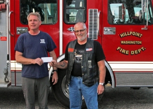 Hillpoint  Fire Department  Chief Andrew Arneson received a $20 donation from  Dan Woolever, president of Border Riders MC of Ironton. (Submitted photos) 